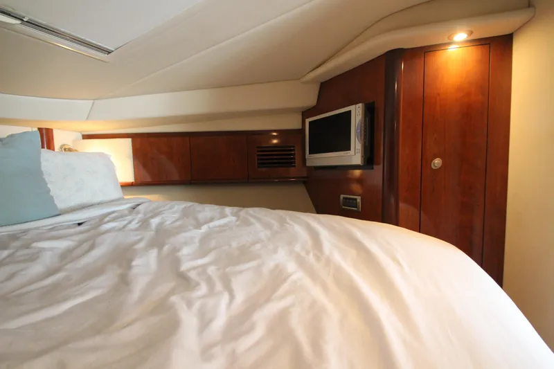  Yacht Photos Pics Luxurious cabin interior of 2004 Sea Ray 40 Sundancer yacht with cozy bedding.