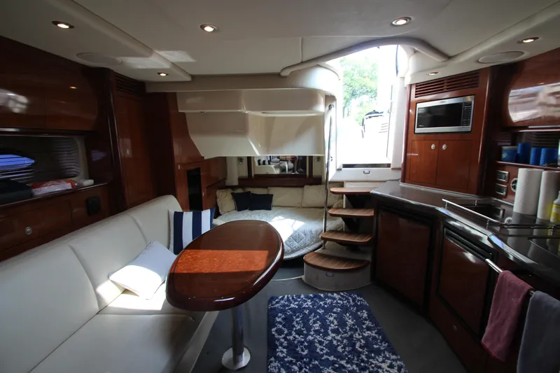  Yacht Photos Pics Luxurious interior of 2004 Sea Ray 40 Sundancer yacht with modern amenities and elegant design.