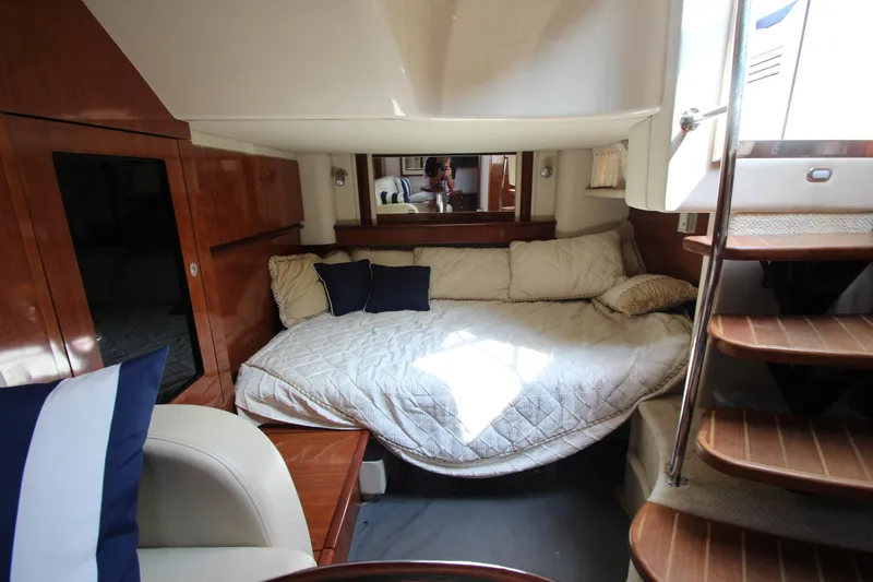  Yacht Photos Pics Luxurious cabin interior of 2004 Sea Ray 40 Sundancer yacht with cozy bedding.