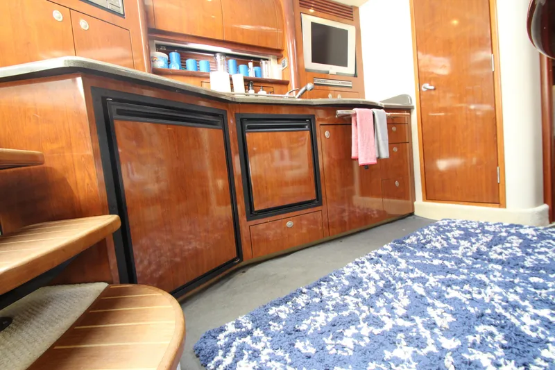  Yacht Photos Pics Interior of 2004 Sea Ray 40 Sundancer yacht with wooden cabinetry and modern amenities.