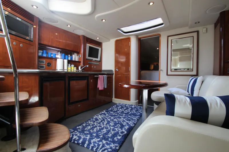  Yacht Photos Pics Luxurious interior of 2004 Sea Ray 40 Sundancer yacht with modern amenities and elegant design.