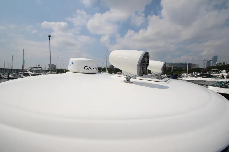  Yacht Photos Pics Radar equipment on a 2004 Sea Ray 40 Sundancer yacht under a cloudy sky.
