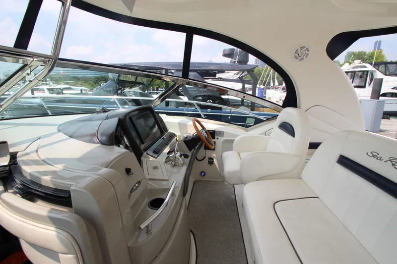  Yacht Photos Pics 2004 Sea Ray 40 Sundancer helm with luxurious seating and modern controls.