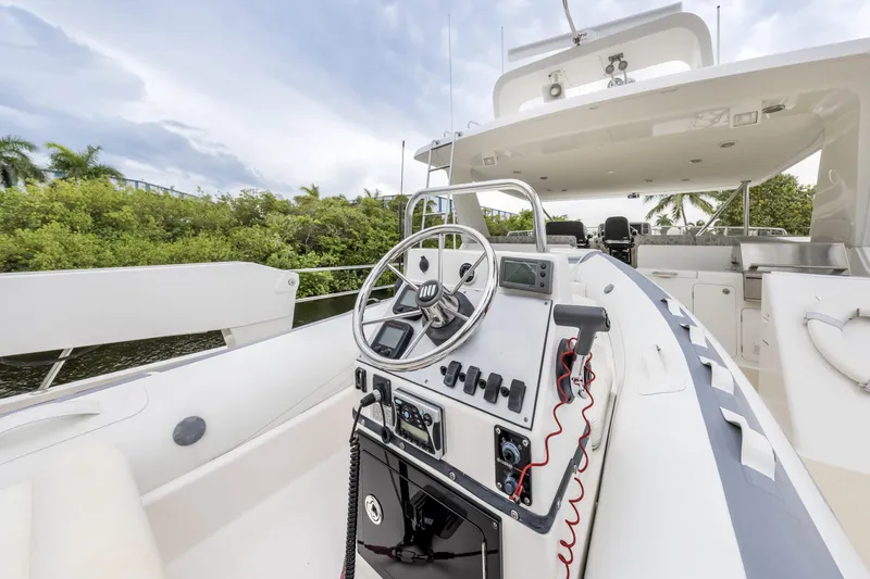 Journey Yacht Photos Pics 2008 Outer Reef Yachts 650 Motoryacht helm with steering wheel and control panel.