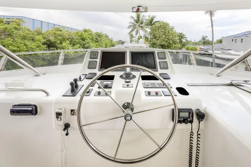 Journey Yacht Photos Pics Helm of 2008 Outer Reef Yachts 650 Motoryacht with navigation controls and steering wheel.