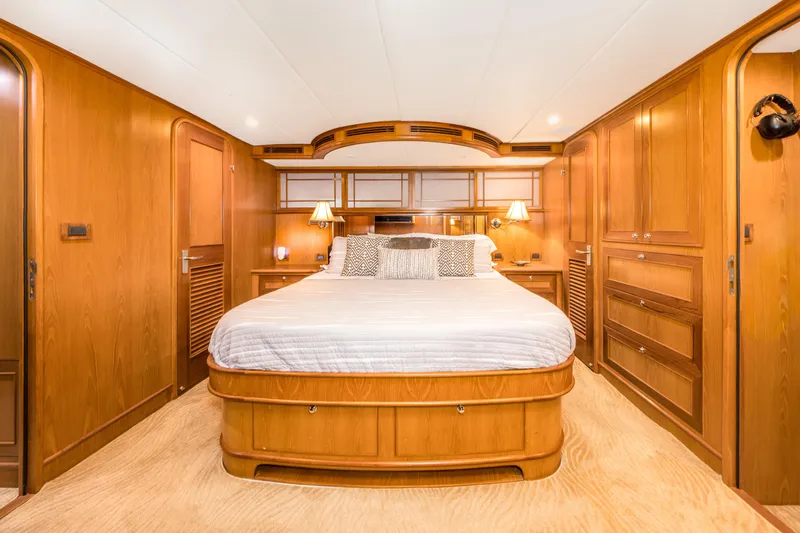 Journey Yacht Photos Pics Luxurious wooden cabin interior of 2008 Outer Reef Yachts 650 Motoryacht with cozy bed.