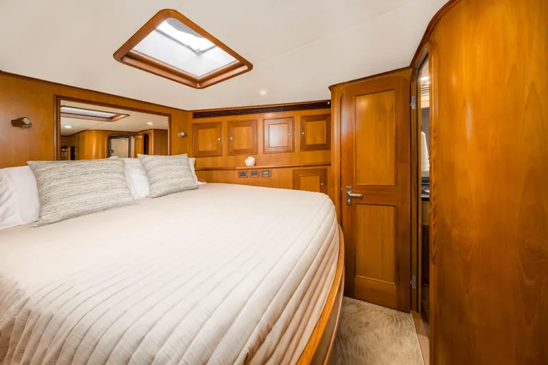 Journey Yacht Photos Pics Luxurious cabin interior of 2008 Outer Reef Yachts 650 Motoryacht with wood finish and skylight.