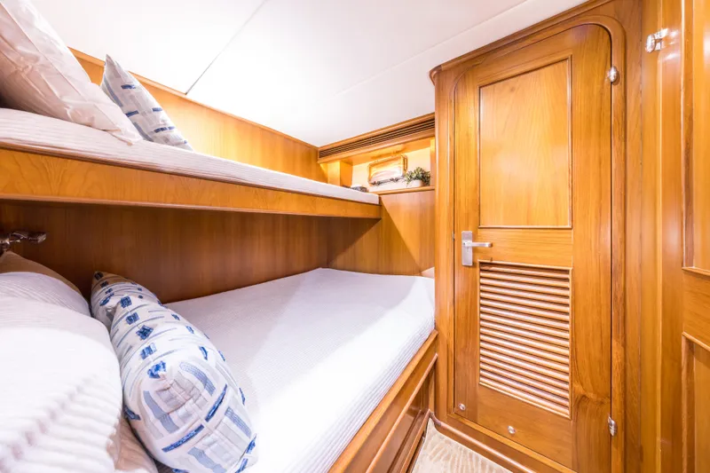 Journey Yacht Photos Pics Luxurious wooden cabin interior of 2008 Outer Reef Yachts 650 Motoryacht with bunk beds.