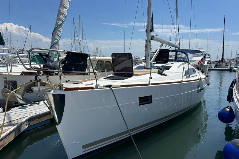 In Stock Now Yacht Photos Pics 2018 Elan 45 Impressions yacht docked in marina under clear blue sky.