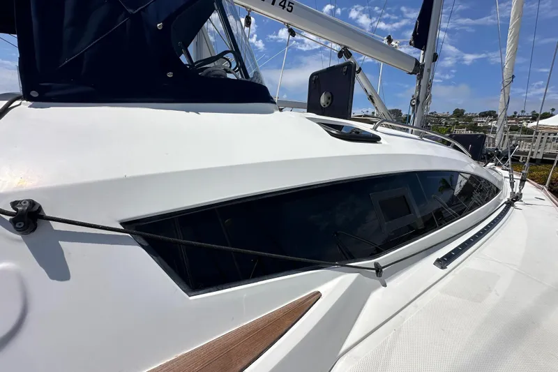 In Stock Now Yacht Photos Pics 2018 Elan 45 Impressions yacht with sleek design and modern features, docked under blue skies.