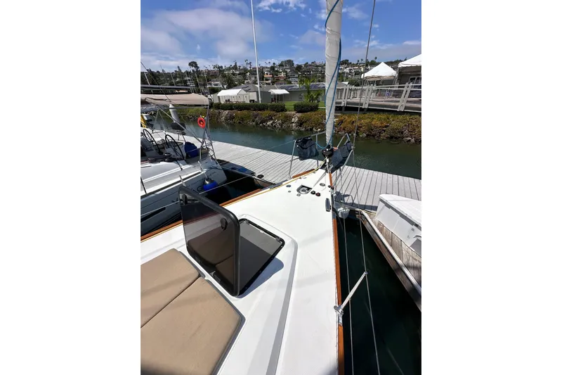 In Stock Now Yacht Photos Pics 2018 Elan 45 Impressions yacht docked at marina, showcasing deck and sail.