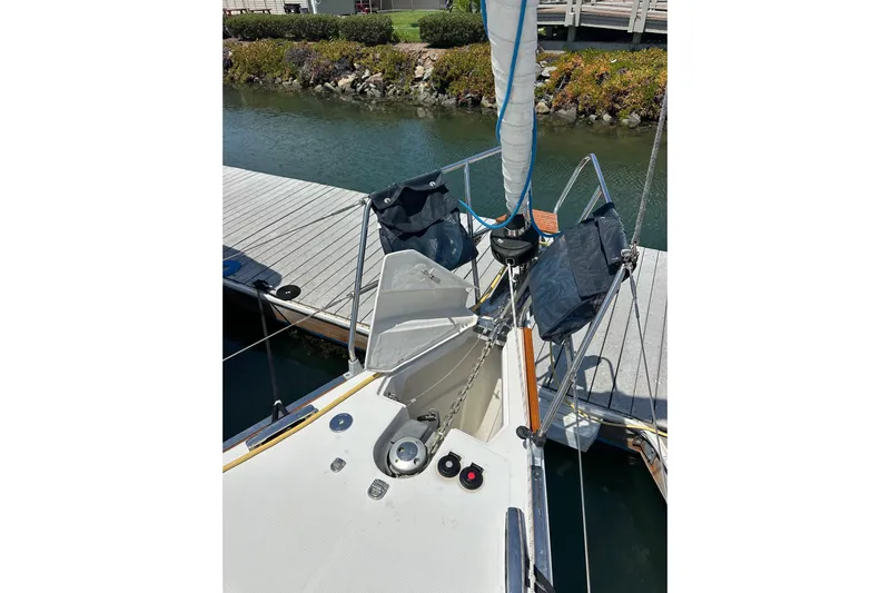 In Stock Now Yacht Photos Pics 2018 Elan 45 Impressions sailboat bow with anchor chain and dock view.