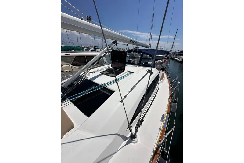 In Stock Now Yacht Photos Pics 2018 Elan 45 Impressions yacht docked at marina, showcasing sleek deck design.