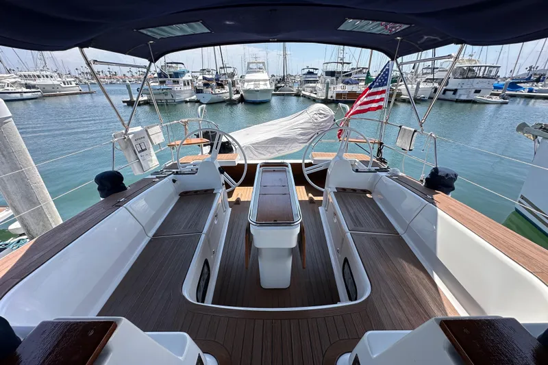 In Stock Now Yacht Photos Pics Spacious cockpit of 2018 Elan 45 Impressions yacht docked at marina.