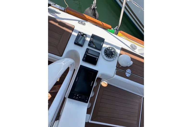 In Stock Now Yacht Photos Pics Cockpit of 2018 Elan 45 Impressions yacht with navigation instruments and wooden accents.