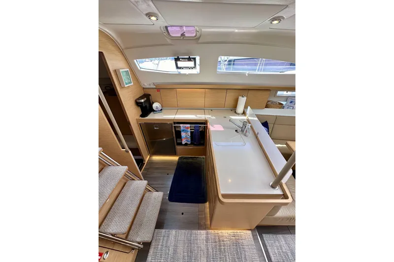 In Stock Now Yacht Photos Pics Modern kitchen interior of 2018 Elan 45 Impressions yacht with sleek design and ample lighting.