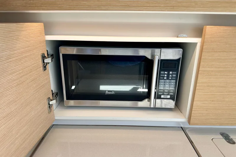 In Stock Now Yacht Photos Pics Built-in microwave in 2018 Elan 45 Impressions yacht kitchen cabinet.