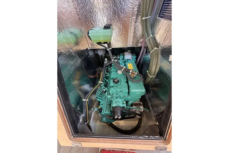 In Stock Now Yacht Photos Pics Engine compartment of a 2018 Elan 45 Impressions yacht, showcasing the engine and components.