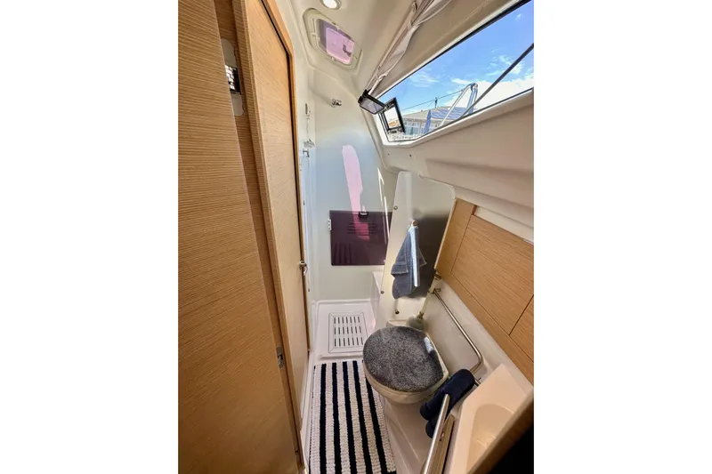 In Stock Now Yacht Photos Pics Interior of 2018 Elan 45 Impressions yacht bathroom with modern fixtures and natural light.