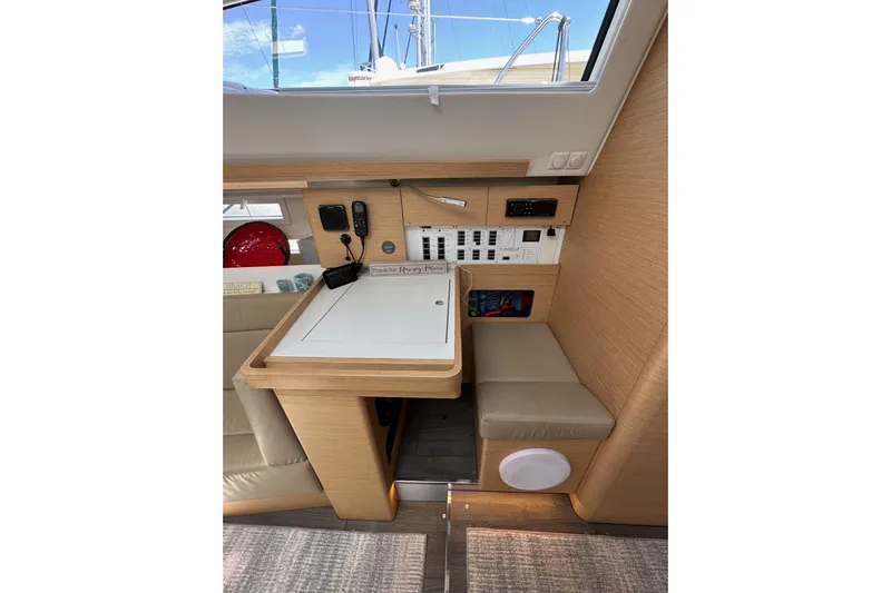 In Stock Now Yacht Photos Pics Interior of 2018 Elan 45 Impressions yacht with navigation station and control panel.