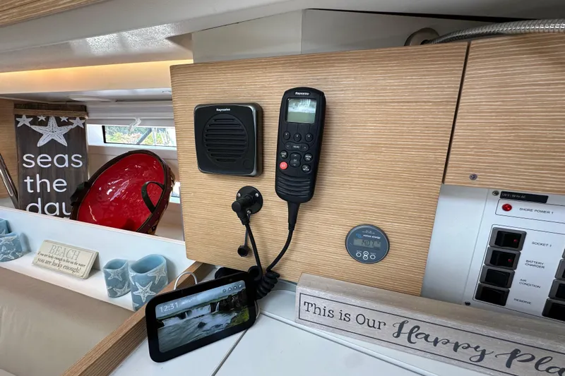 In Stock Now Yacht Photos Pics Interior of 2018 Elan 45 Impressions yacht with navigation equipment and decorative signs.