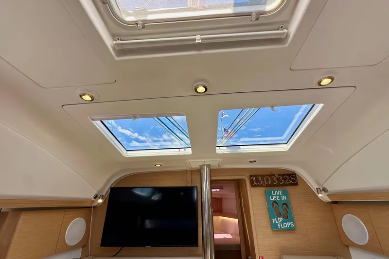 In Stock Now Yacht Photos Pics Interior of 2018 Elan 45 Impressions yacht with skylights and modern decor.