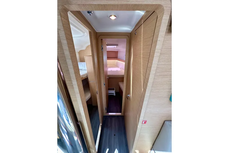 In Stock Now Yacht Photos Pics Interior view of 2018 Elan 45 Impressions yacht, featuring modern wood finish and cozy cabin.