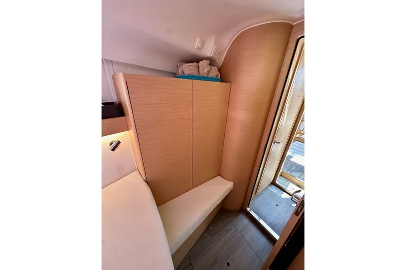 In Stock Now Yacht Photos Pics Interior of 2018 Elan 45 Impressions yacht, featuring wooden cabinetry and seating.