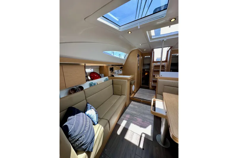In Stock Now Yacht Photos Pics Luxurious interior of 2018 Elan 45 Impressions yacht with skylight and modern furnishings.