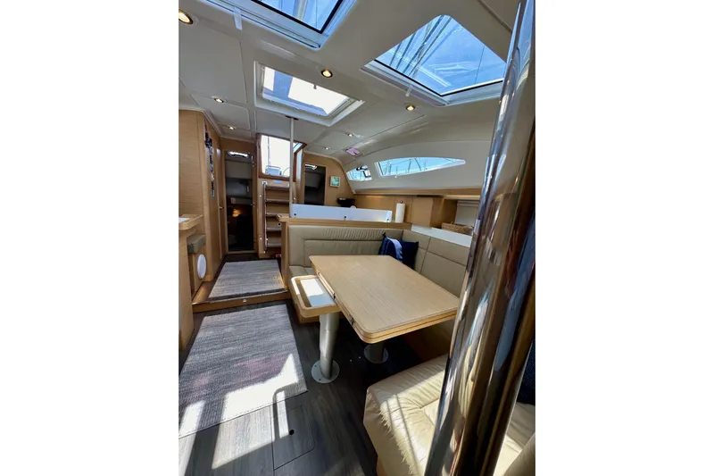 In Stock Now Yacht Photos Pics Interior of 2018 Elan 45 Impressions yacht with modern seating and skylights.