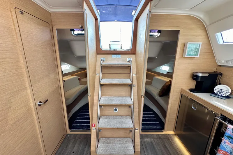 In Stock Now Yacht Photos Pics Interior of 2018 Elan 45 Impressions yacht with modern design and cozy seating.