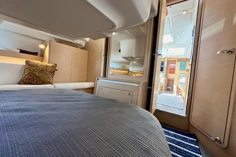 In Stock Now Yacht Photos Pics Luxurious interior of 2018 Elan 45 Impressions yacht, featuring cozy bedroom and modern design.