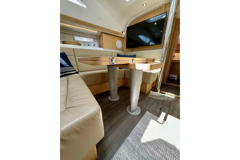 In Stock Now Yacht Photos Pics Interior of 2018 Elan 45 Impressions yacht with modern seating and table.