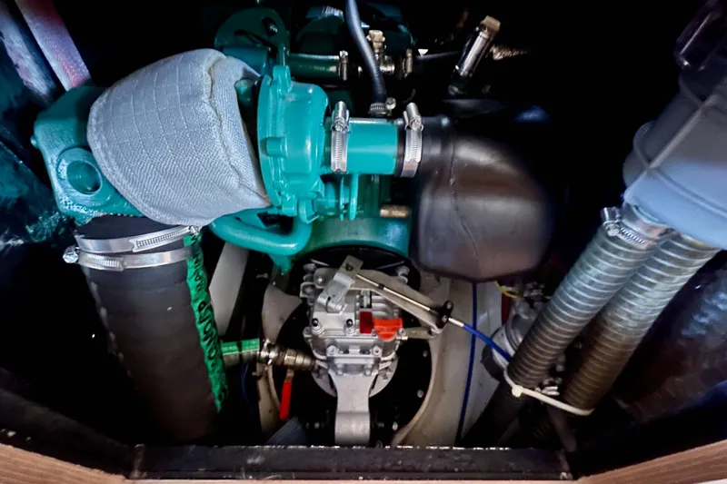 In Stock Now Yacht Photos Pics Engine compartment of 2018 Elan 45 Impressions yacht, showcasing mechanical components and hoses.