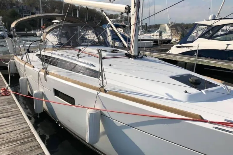  Yacht Photos Pics 2019 Jeanneau Sun Odyssey 349 sailboat docked at marina, featuring sleek design and modern amenities.