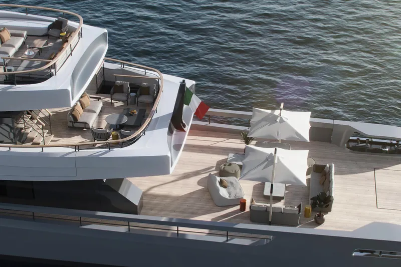  Yacht Photos Pics Luxurious Rossinavi Berserk 47 yacht deck with elegant seating, umbrellas, and ocean view, 2026 model.