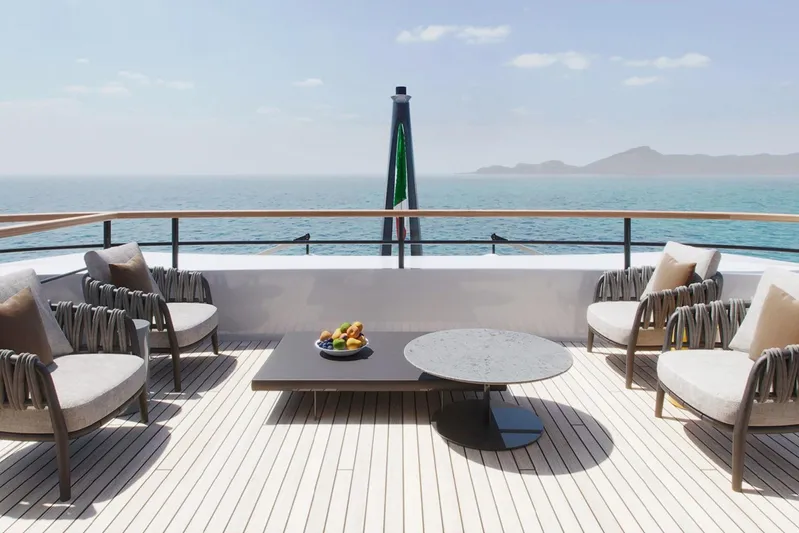  Yacht Photos Pics Luxurious deck of 2026 Rossinavi Berserk 47 yacht with ocean view and elegant seating.