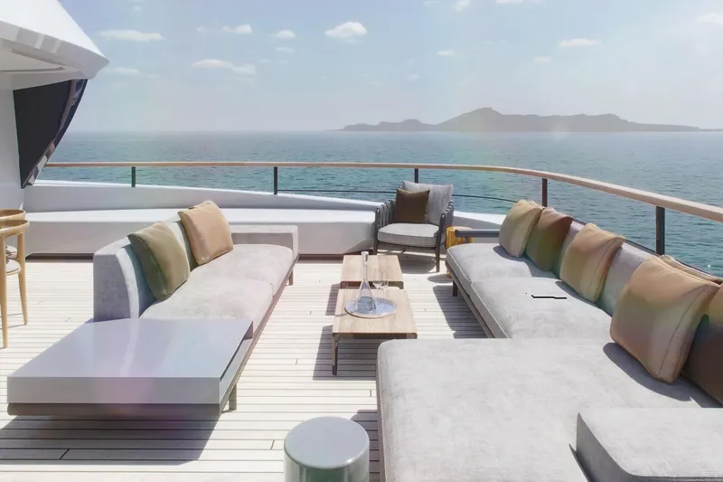  Yacht Photos Pics Luxurious deck of Rossinavi Berserk 47 yacht, 2026 model, with ocean view and elegant seating.