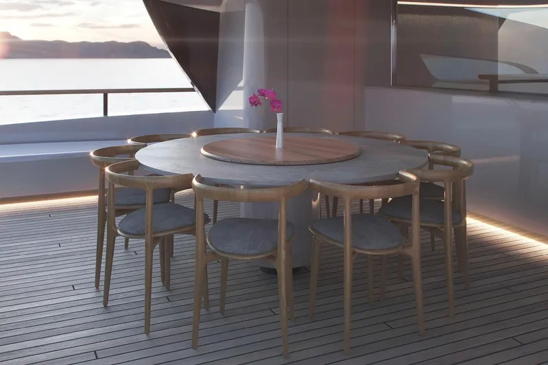  Yacht Photos Pics Luxury yacht Rossinavi Berserk 47 (2026) dining area with elegant round table and chairs.