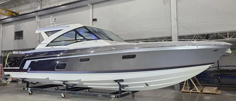  Yacht Photos Pics 2020 Formula 430 Super Sport Crossover boat in a showroom, side view.