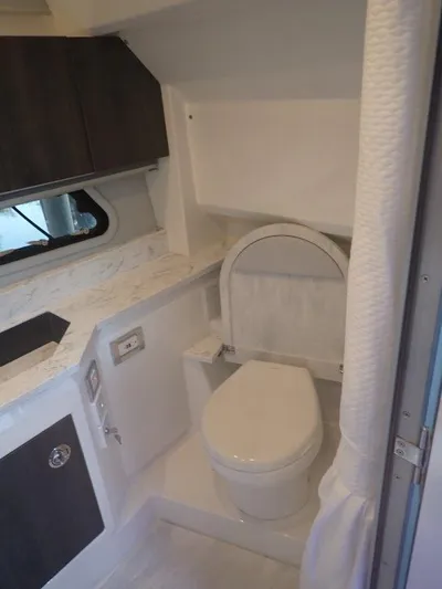  Yacht Photos Pics 2020 Formula 430 Super Sport Crossover bathroom with modern fixtures and marble countertop.