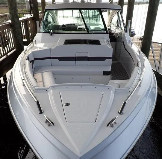 Yacht Photos Pics 2020 Formula 430 Super Sport Crossover boat docked, showcasing sleek design and spacious seating.