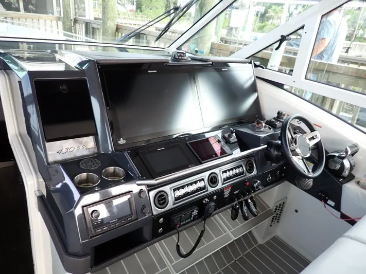  Yacht Photos Pics 2020 Formula 430 Super Sport Crossover helm with advanced navigation and control systems.