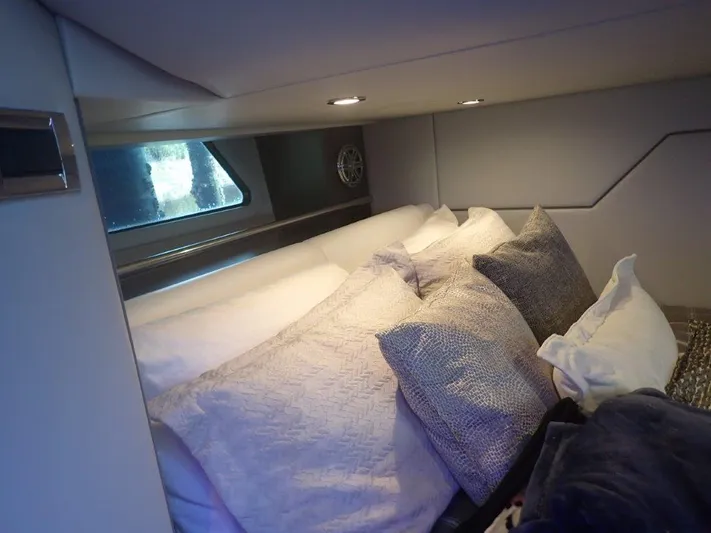  Yacht Photos Pics Cozy cabin interior of 2020 Formula 430 Super Sport Crossover with plush pillows and soft lighting.