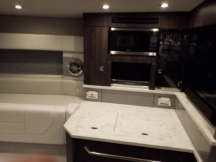  Yacht Photos Pics Luxurious interior of 2020 Formula 430 Super Sport Crossover with modern kitchen amenities.