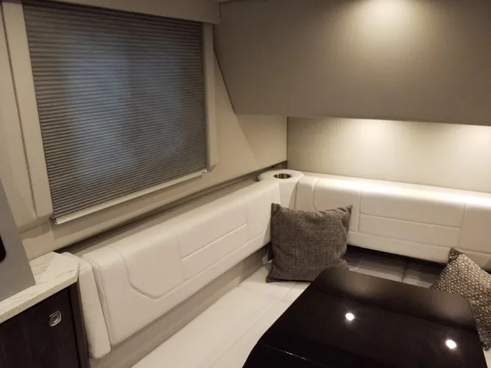  Yacht Photos Pics 2020 Formula 430 Super Sport Crossover interior with white seating and cushions.