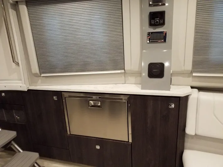  Yacht Photos Pics Interior of 2020 Formula 430 Super Sport Crossover with modern cabinetry and control panel.