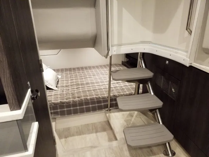  Yacht Photos Pics Interior of 2020 Formula 430 Super Sport Crossover, featuring a cozy cabin with a bed and stairs.