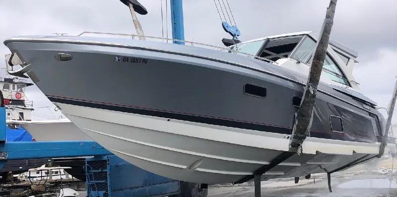  Yacht Photos Pics 2020 Formula 430 Super Sport Crossover boat in dry dock, gray hull, sleek design.