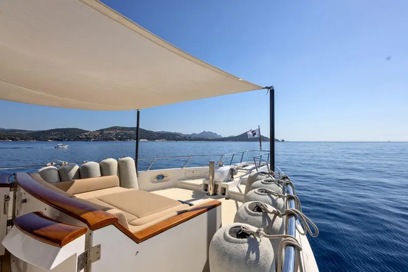 Sedna Yacht Photos Pics Luxurious 2020 Jet Tern SELENE 72 yacht deck with sunshade, overlooking serene ocean view.